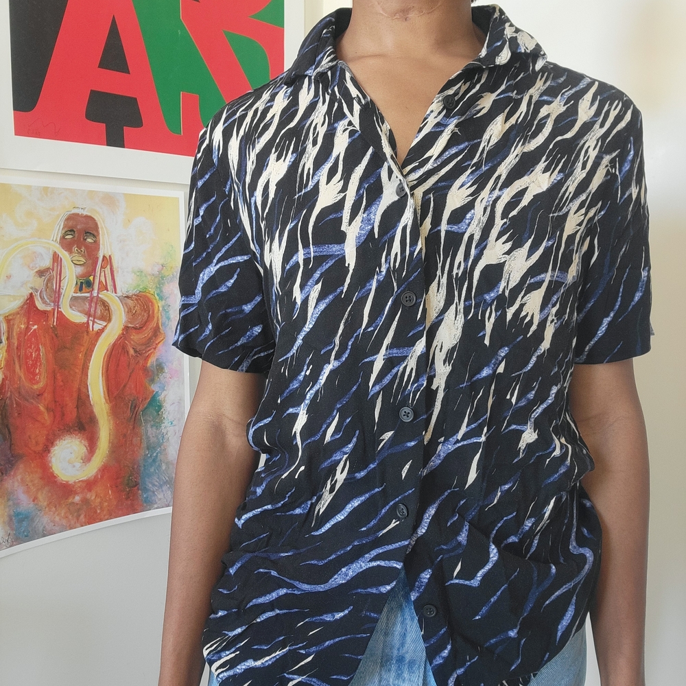 Black, cream, and blue button up shirt